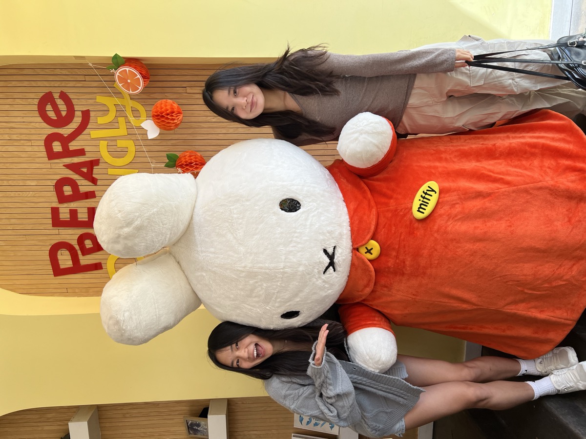 Posing with a Miffy mascot at an event